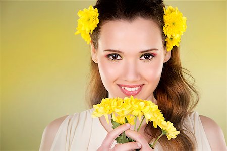 simsearch:400-07986693,k - cuacasian woman wearing yellow flowers on green background Stock Photo - Budget Royalty-Free & Subscription, Code: 400-08131692