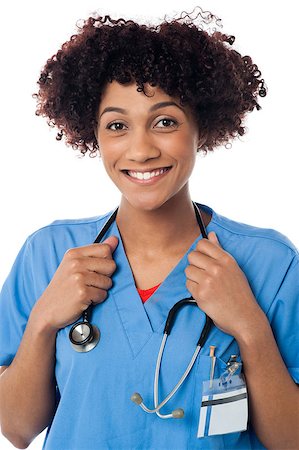simsearch:400-08131186,k - Smiling curly haired lady doctor with stethoscope around her neck. Foto de stock - Royalty-Free Super Valor e Assinatura, Número: 400-08154194