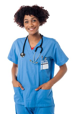 simsearch:400-08131186,k - Young woman in doctor's uniform posing with hands in pockets. Stock Photo - Budget Royalty-Free & Subscription, Code: 400-08154195