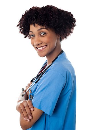 simsearch:400-08131186,k - Side profile of smiling young curly haired lady doctor looking at you. Foto de stock - Royalty-Free Super Valor e Assinatura, Número: 400-08154197