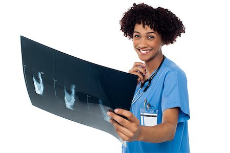 simsearch:400-08131186,k - Young smiling female surgeon holding x-ray sheet and looking at camera. Stock Photo - Budget Royalty-Free & Subscription, Code: 400-08154199