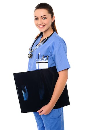 simsearch:400-08131186,k - Young orthopedic female surgeon holding x-ray report of a patient Foto de stock - Royalty-Free Super Valor e Assinatura, Número: 400-08154286