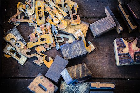 simsearch:400-08165944,k - Rusty metal and vintage wooden letterpress numbers, letters, and star symbol inside a dirty wooden printer drawer. Photographie de stock - Aubaine LD & Abonnement, Code: 400-08154879