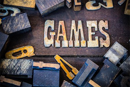 simsearch:400-08166004,k - The word GAMES written in rusted metal letters surrounded by vintage wooden and metal letterpress type. Stock Photo - Budget Royalty-Free & Subscription, Code: 400-08154870