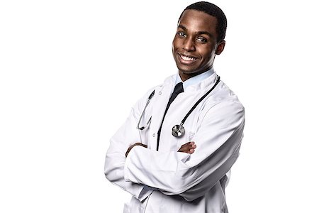 Attractive confident male African doctor wearing a white lab coat and stethoscope looking at the camera with a happy expression, upper body isolated on white Stock Photo - Budget Royalty-Free & Subscription, Code: 400-08154941