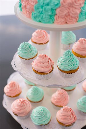 simsearch:400-05316582,k - Lots of fancy cupcakes. Frosted in pink and green. Pastel tones. Stock Photo - Budget Royalty-Free & Subscription, Code: 400-08155014