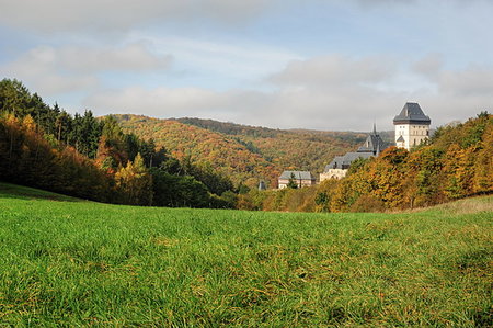 simsearch:400-05310861,k - Karlstejn Castle in beautiful autumn colored landscape with the sun Stock Photo - Budget Royalty-Free & Subscription, Code: 400-08155331