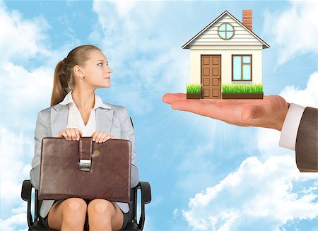 Businesswoman sitting in the chair and looking at house and keys in mans hand Stock Photo - Budget Royalty-Free & Subscription, Code: 400-08155754