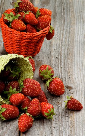 simsearch:400-08020671,k - Fresh Ripe Forest Strawberries in Two Wicker Baskets closeup on Rustic Wooden background Stock Photo - Budget Royalty-Free & Subscription, Code: 400-08155949