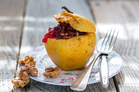 simsearch:400-06946823,k - Baked apple with nuts and cowberry on an old table. Fotografie stock - Microstock e Abbonamento, Codice: 400-08157228