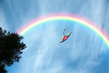 simsearch:400-04958295,k - Air multicolored kite flying in the blue sky Stockbilder - Microstock & Abonnement, Bildnummer: 400-08159217