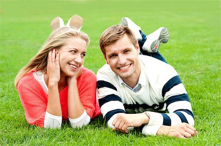 Romantic young couple outdoors in the park. Lying and relaxing Stock Photo - Budget Royalty-Free & Subscription, Code: 400-08151397