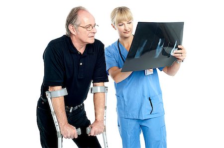 simsearch:400-07976358,k - Surgeon explaining the x-ray report to the patient. Stock Photo - Budget Royalty-Free & Subscription, Code: 400-08151497