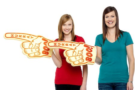 fan and foam finger - Cheerful fans pointing the big foam hand sideways. Half length portrait. Stock Photo - Budget Royalty-Free & Subscription, Code: 400-08151674