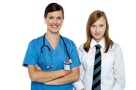 simsearch:400-08131186,k - Confident medical expert posing with young school girl dressed in uniform. Stock Photo - Budget Royalty-Free & Subscription, Code: 400-08151699