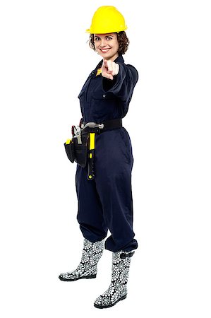Beautiful female worker in jumpsuit pointing at you. Stock Photo - Budget Royalty-Free & Subscription, Code: 400-08151801