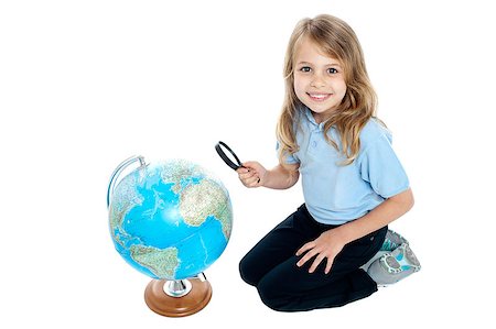 Happy young kid with magnifying glass kneeling on the floor, globe placed in front of her. Stock Photo - Budget Royalty-Free & Subscription, Code: 400-08151888