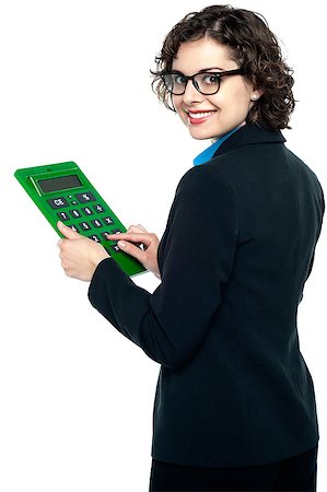 Bespectacled entrepreneur using calculator. Turning back and smiling. Photographie de stock - Aubaine LD & Abonnement, Code: 400-08151942