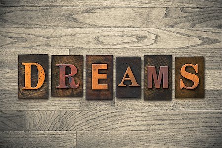 simsearch:400-08152413,k - The word "DREAMS" theme written in vintage, ink stained, wooden letterpress type on a wood grained background. Foto de stock - Super Valor sin royalties y Suscripción, Código: 400-08152396