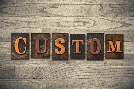 simsearch:400-08152413,k - The word "CUSTOM" theme written in vintage, ink stained, wooden letterpress type on a wood grained background. Foto de stock - Super Valor sin royalties y Suscripción, Código: 400-08152390