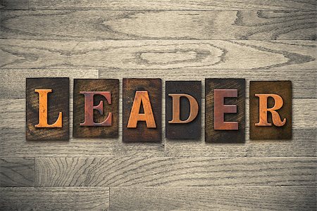 simsearch:400-08152413,k - The word "LEADER" theme written in vintage, ink stained, wooden letterpress type on a wood grained background. Foto de stock - Super Valor sin royalties y Suscripción, Código: 400-08152409