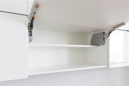 simsearch:400-06694997,k - opened white kitchen cabinet with empty shelf Stock Photo - Budget Royalty-Free & Subscription, Code: 400-08152451