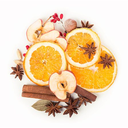 Christmas frame. Christmas spices and dried orange sliceson Fotografie stock - Microstock e Abbonamento, Codice: 400-08152717