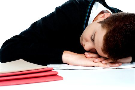 sleeping in a classroom - Bored student sleeping during a lecture in classroom. Hands as his pillow Stock Photo - Budget Royalty-Free & Subscription, Code: 400-08153017