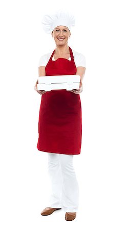 Full length portrait of woman chef offering hot fresh pizza packed well Stock Photo - Budget Royalty-Free & Subscription, Code: 400-08153076