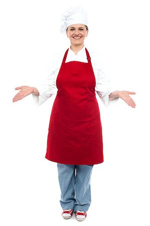 Female chef welcoming you with a smile, full length shot Stock Photo - Budget Royalty-Free & Subscription, Code: 400-08153109