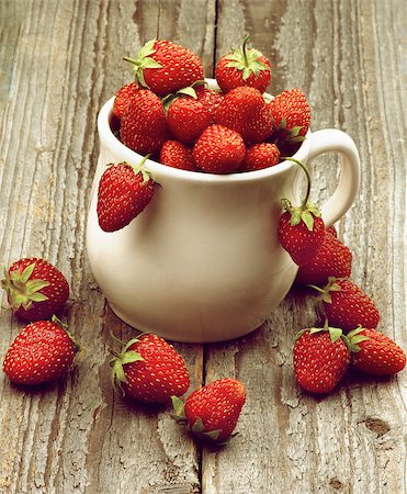 simsearch:400-08020671,k - Heap of Fresh Ripe Forest Strawberries in White Bowl closeup on Rustic Wooden background. Retro Styled Stock Photo - Budget Royalty-Free & Subscription, Code: 400-08153388
