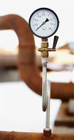 steam valve - manometer on the old rusty pipe close up Stock Photo - Budget Royalty-Free & Subscription, Code: 400-08153530