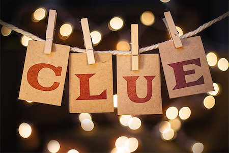 simsearch:400-08153760,k - The word CLUE printed on clothespin clipped cards in front of defocused glowing lights. Stockbilder - Microstock & Abonnement, Bildnummer: 400-08153743