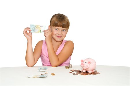 Smiling little  girl with money in hands and piggy bank on table isolated Stockbilder - Microstock & Abonnement, Bildnummer: 400-08153779