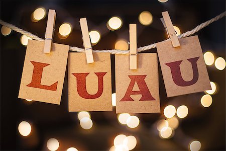 simsearch:400-08153760,k - The word LUAU printed on clothespin clipped cards in front of defocused glowing lights. Stockbilder - Microstock & Abonnement, Bildnummer: 400-08153834