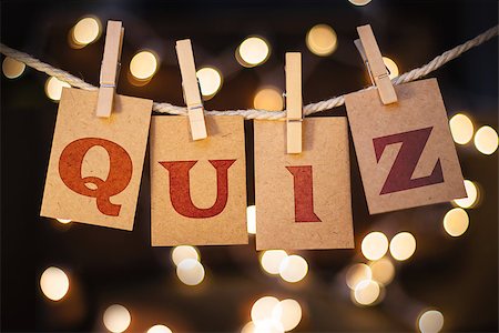 simsearch:400-08153760,k - The word QUIZ printed on clothespin clipped cards in front of defocused glowing lights. Stockbilder - Microstock & Abonnement, Bildnummer: 400-08153838