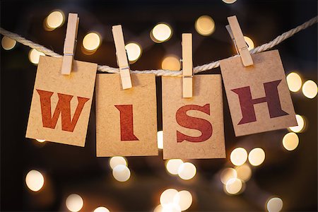 simsearch:400-08153760,k - The word WISH printed on clothespin clipped cards in front of defocused glowing lights. Stockbilder - Microstock & Abonnement, Bildnummer: 400-08153861