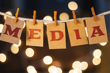 simsearch:400-08153760,k - The word MEDIA printed on clothespin clipped cards in front of defocused glowing lights. Stockbilder - Microstock & Abonnement, Bildnummer: 400-08153946