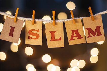 simsearch:400-08153760,k - The word ISLAM printed on clothespin clipped cards in front of defocused glowing lights. Stockbilder - Microstock & Abonnement, Bildnummer: 400-08153941