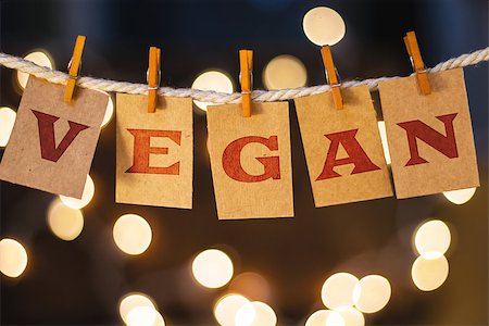 simsearch:400-08153760,k - The word VEGAN printed on clothespin clipped cards in front of defocused glowing lights. Stockbilder - Microstock & Abonnement, Bildnummer: 400-08153970