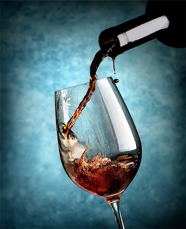 simsearch:400-04919991,k - Wine pouring in wineglass on a blue background Foto de stock - Royalty-Free Super Valor e Assinatura, Número: 400-08164487