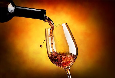 simsearch:400-04264239,k - Wine pouring in wineglass on an orange background Stock Photo - Budget Royalty-Free & Subscription, Code: 400-08164489