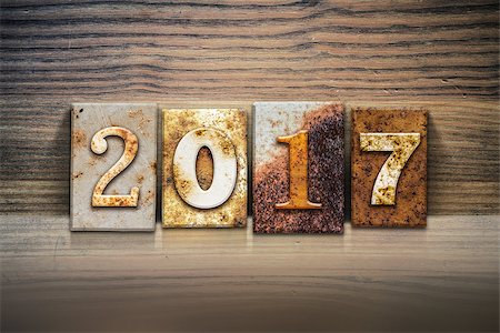 simsearch:400-08154669,k - The word "2017" written in rusty metal letterpress type sitting on a wooden ledge background. Stock Photo - Budget Royalty-Free & Subscription, Code: 400-08164726
