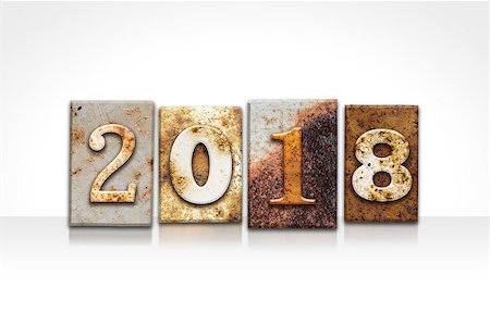 The word "2018" written in rusty metal letterpress type isolated on a white background. Stock Photo - Budget Royalty-Free & Subscription, Code: 400-08164728