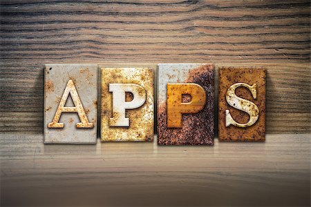 simsearch:400-08166276,k - The word "APPS" written in rusty metal letterpress type sitting on a wooden ledge background. Stock Photo - Budget Royalty-Free & Subscription, Code: 400-08164745