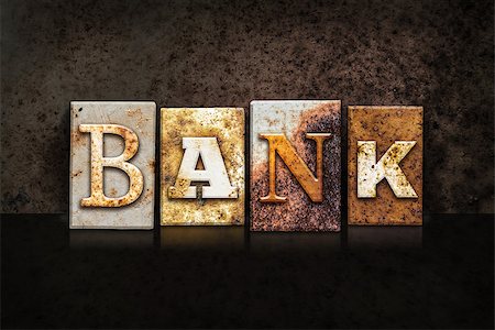 The word "BANK" written in rusty metal letterpress type on a dark textured grunge background. Stock Photo - Budget Royalty-Free & Subscription, Code: 400-08164757