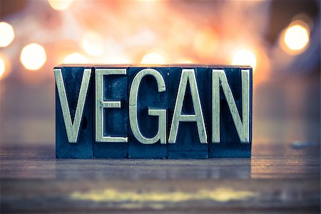 The word VEGAN written in vintage metal letterpress type on a soft backlit background. Foto de stock - Super Valor sin royalties y Suscripción, Código: 400-08161055