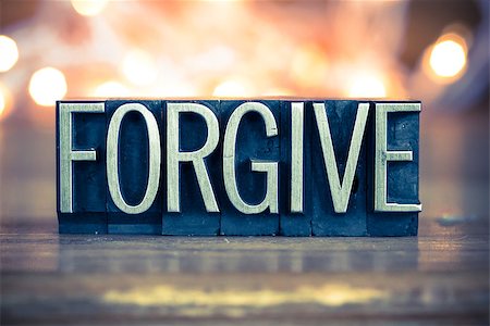 simsearch:400-08161047,k - The word FORGIVE written in vintage metal letterpress type on a soft backlit background. Stock Photo - Budget Royalty-Free & Subscription, Code: 400-08161071