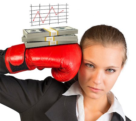 simsearch:400-08161703,k - Businesswoman in boxing gloves with graph and money looking at camera on isolated white background Photographie de stock - Aubaine LD & Abonnement, Code: 400-08161695