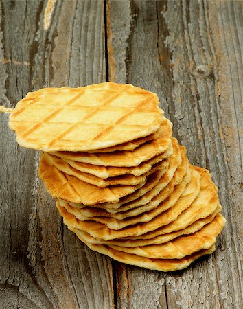 simsearch:400-07420117,k - Stack of Crunchy Thin Waffles isolated on Rustic Wooden background Stock Photo - Budget Royalty-Free & Subscription, Code: 400-08162201